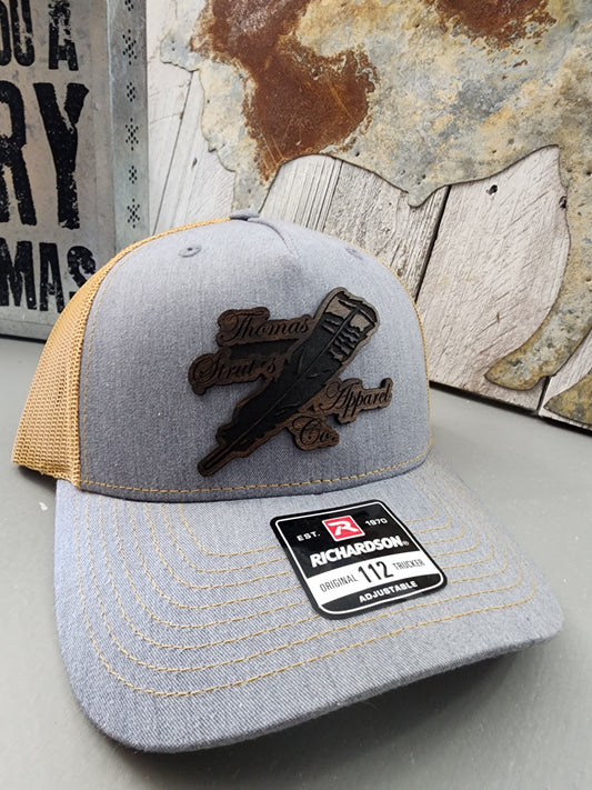 Men's Thomas Strut's Apparel Co. Leather Patch Trucker Hat-Heather Grey/Amber Gold
